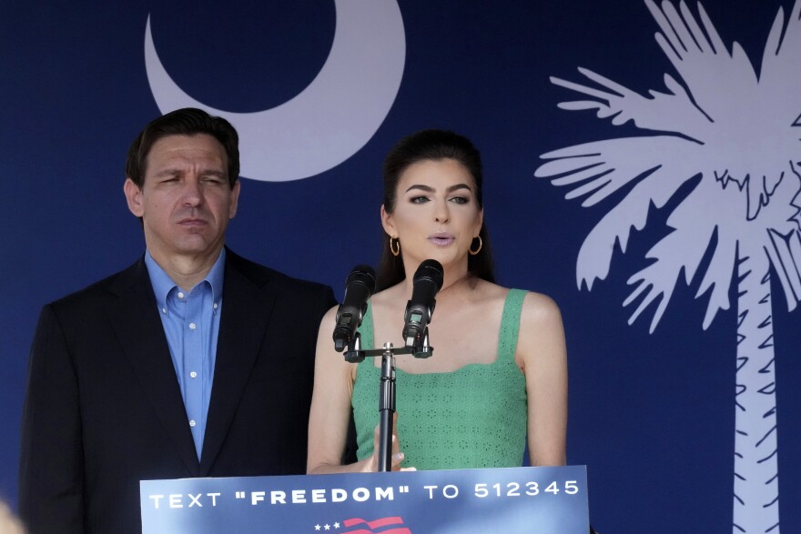 FILE - Florida Gov. Ron DeSantis, left, looks on as his wife Casey DeSantis speaks at a campaign event in Bluffton, S.C., June 2, 2023.