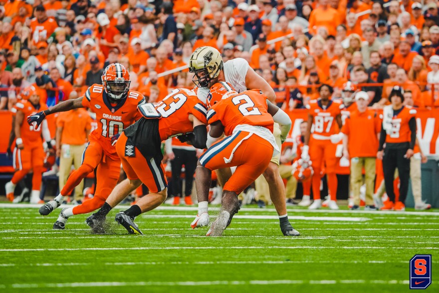 Syracuse defensemen Justin Barron (23) and Marlowe Was (2) join forces for an open field tackle in the second quarter of SU’s 32-29 win over Purdue. The pair combined for 13 total tackles in the game.