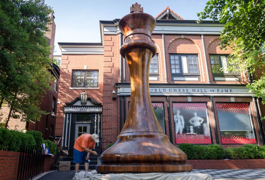 Bob Fowler does work July 16, 2018, on the world's largest chess piece, set outside of the World Chess Hall of Fame in St. Louis' Central West End.