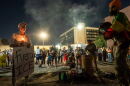 Dozens of people hold a vigil outside an immigration processing center in downtown Fresno, Calif. on Oct. 7, 2026.