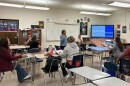 Adults in the Spanish GED preparation program listen to their teacher during a class at Parkland High School in Winston-Salem at the end of May.
