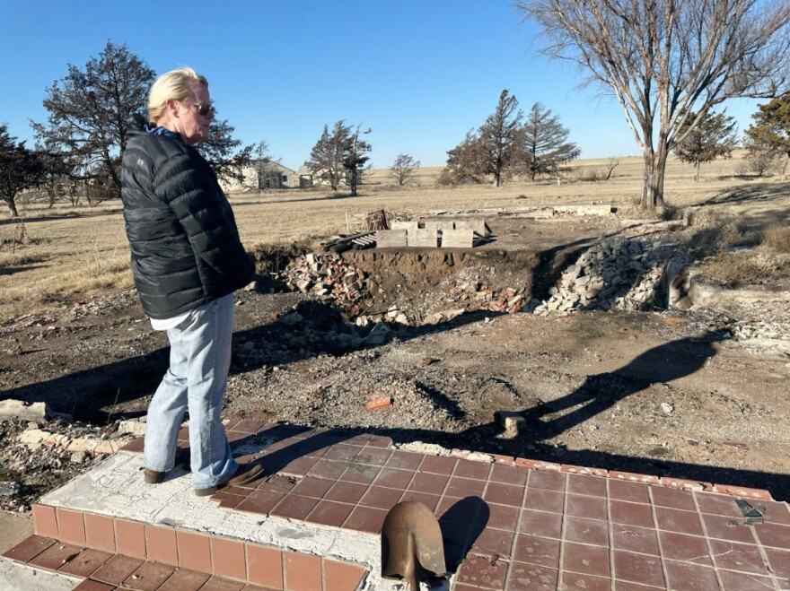 Beth Ramp, a rancher in Hemphill County, looks at the area where her home once stood on Feb. 24, 2025. Ramp’s home and barn were destroyed in the Smokehouse Creek fire in 2024.