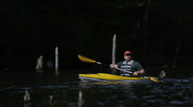 A man kayaks on Monksville Reservoir, Sunday, May 21, 2017, in Hewitt, N.J.. as the region gears up for the summer season kicking off on Memorial Day weekend. (Julio Cortez/AP)