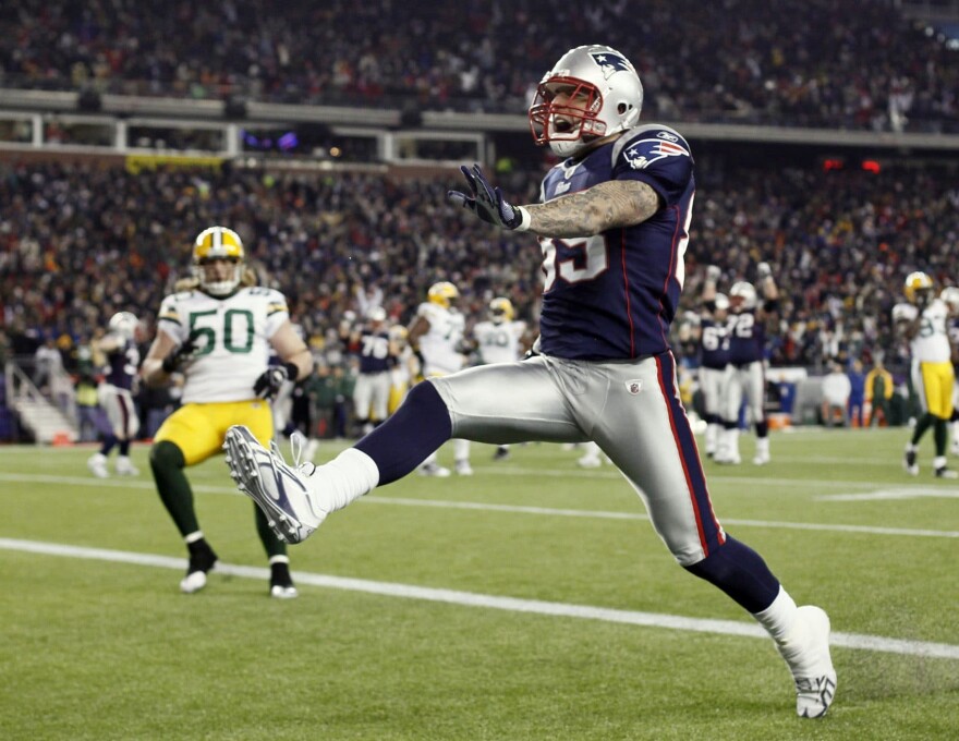 New England Patriots tight end Aaron Hernandez high steps into the end zone during the fourth quarter of New England's 31-27 win against the Green Bay Packers in a NFL football game at Gillette Stadium in Foxborough, Mass. Sunday, Dec. 19, 2010. (Winslow Townson/AP)