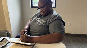 Audrey Carma, founder of WannaBuddy, writes in her journal before an interview.