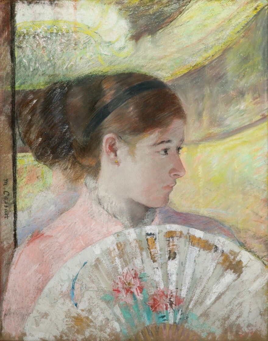 In her 1878-1879 work, <em>At the Theater</em>, Cassatt incorporates metallic paint with gouache and pastel.