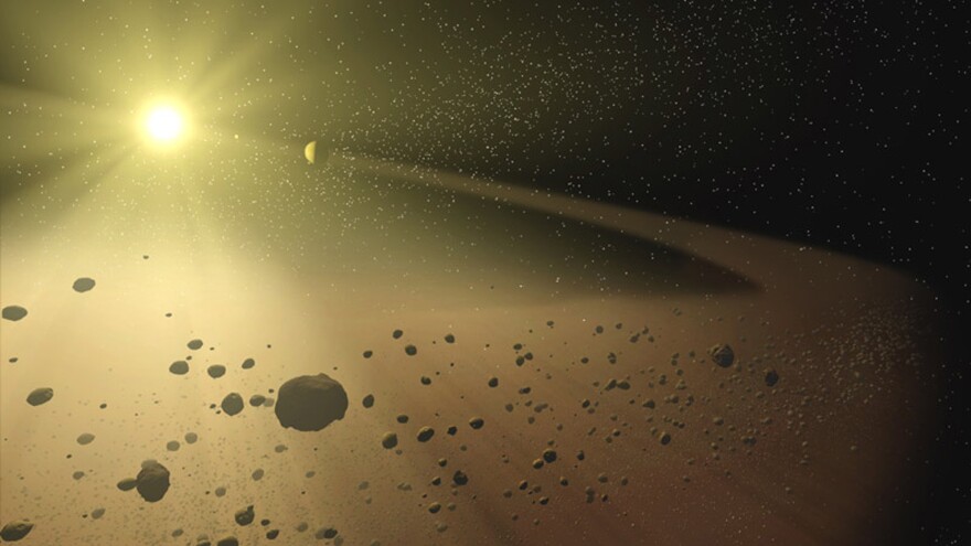 An artist's concept of a narrow asteroid belt orbiting a star similar to our own sun.