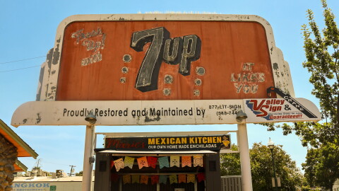 The 7UP billboard in Merced sits on Main Street next to the restaurant Maria’s Mexican Kitchen.