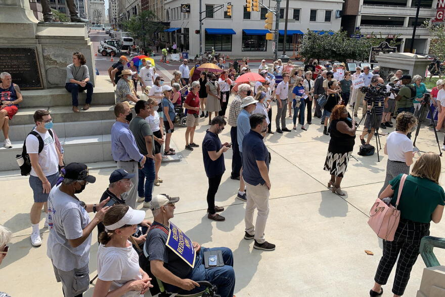 Redistricting reform advocates rallied outside the Statehouse ahead of a legislative hearing.