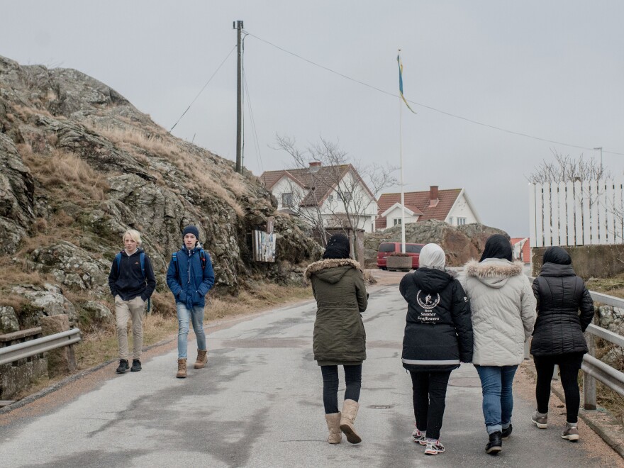 Refugees walk around Kladesholmen, Sweden, on Feb. 10. Last year, Sweden received more than 160,000 asylum applications, more than any European country proportionate to its population.