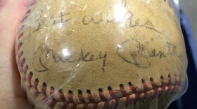 A baseball autographed by Mickey Mantle was one of many items auctioned by the state Treasurer's office.