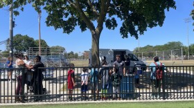 Kids line up for free summer meals distributed at Burnham Park on Milwaukee's South Side on July 29, 2026. Hunger Task Force provides the free meals five days a week in summer at 170 distribution sites across the city. When the truck arrives, Hunger Task Force partner Willie Wilson says there's always an excited line of children waiting.