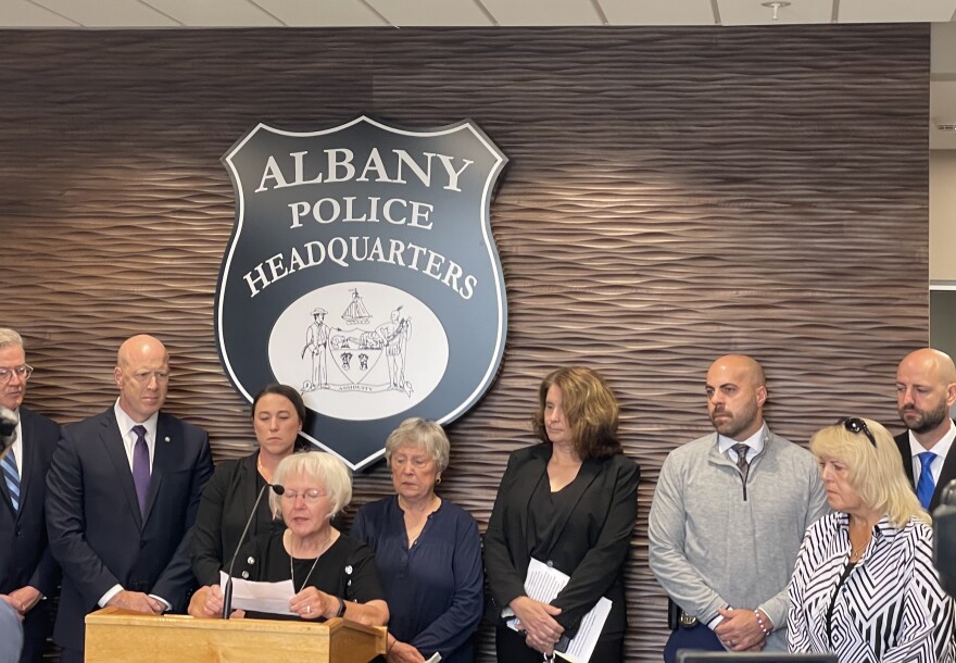 Sandy Carmichael speaking with Albany law enforcement officials