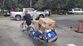 A evening food distribution in Immokalee recently let those who might not be able to attend a daytime event get access to needed food staples and supplies.
