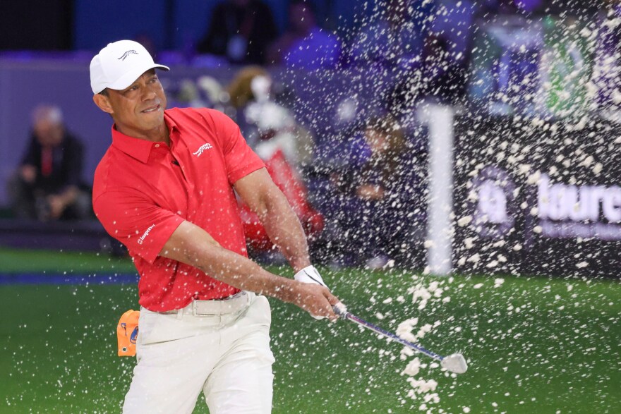 Tiger Woods of the Jupiter Links Golf Club plays a shot from a bunker on the eighth hole, during final day of TGL golf tournament, Tuesday, March 24, 2026, in Palm Beach Gardens Fla.