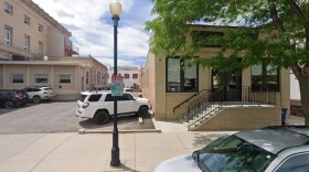 Brick building with cars outside 