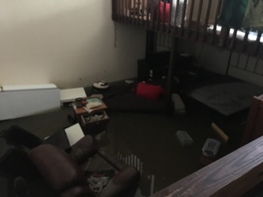 A bedroom within the Pena house is still flooded. Furniture and keepsakes are lost. (WUFT/Sammi Sontag)