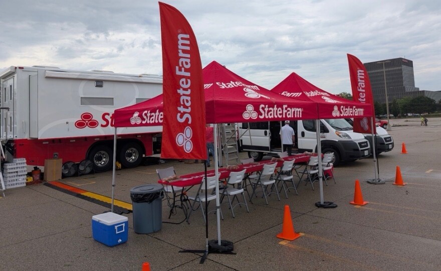 State Farm set up an operation in the parking lot of its headquarters Friday.