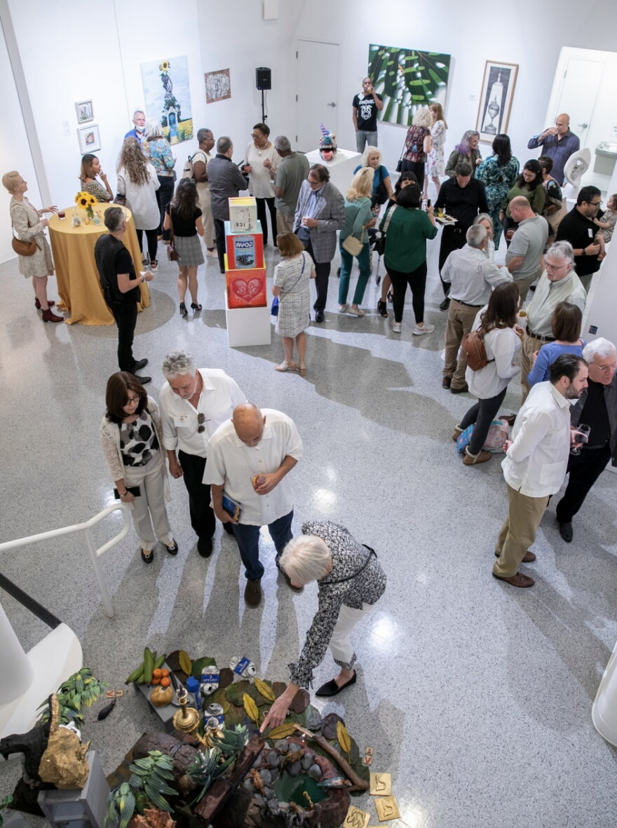 People attending an art exhibition at the Cultural Council for Palm Beach County