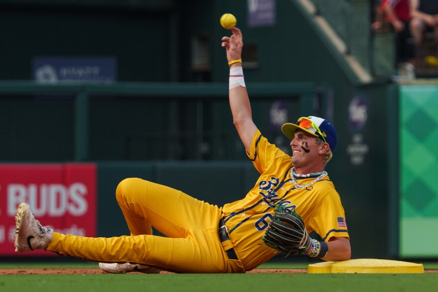 Shortstop Ryan Cox tosses the ball back to the pitcher while he lays on second base during a baseball game between the Savannah Bananas and the Party Animals at Busch Stadium on Friday, July 18, 2025, in downtown St. Louis.