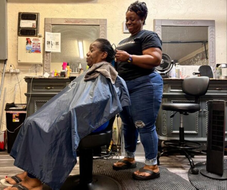 Rhonda Calahan, a Sarasota hair stylist and survivor of domestic violence, works on client Shirley Shaw at her salon. Calahan says sharing her story and helping other women heal has become a ministry — a way to turn her survival into purpose.