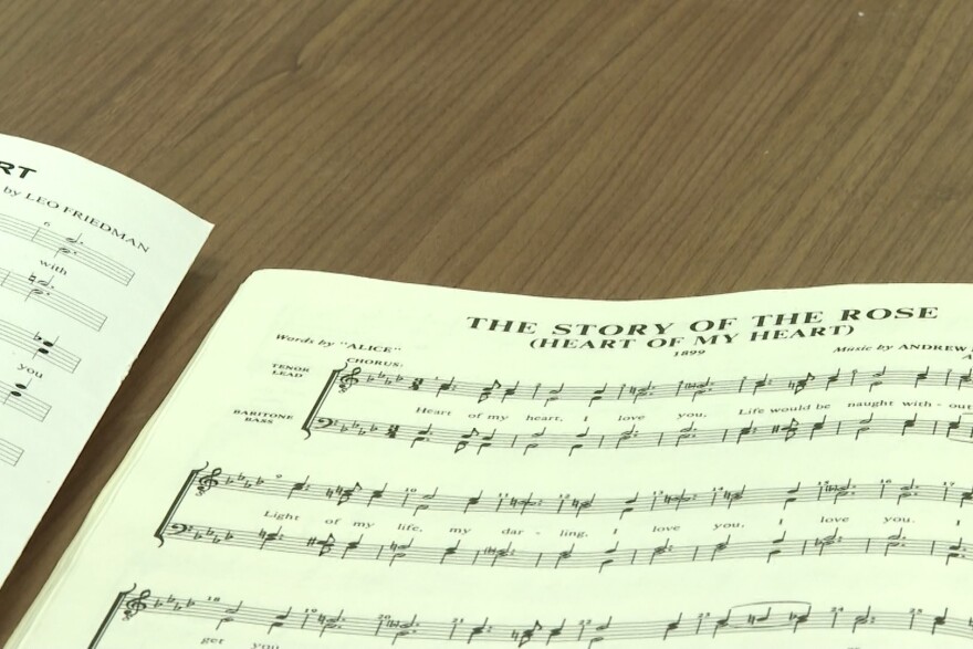 One of the songs the barbershop quartet has prepared is "The Story of the Rose."