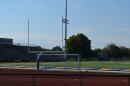 A goal post sits at the end of a football field.