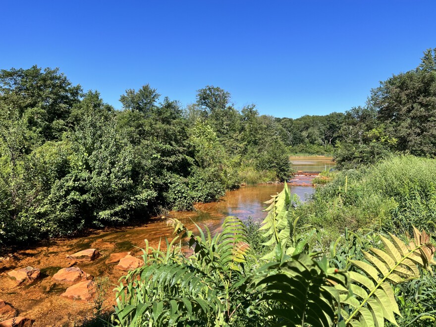 The Nanticoke Creek is rust color because of acid mine drainage from the coal mines below.