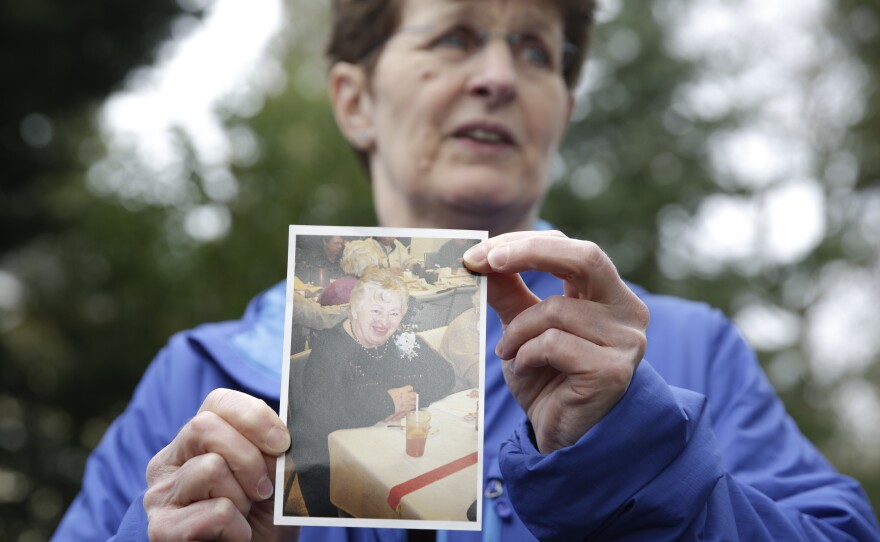 Pat Herrick holds a photo of her mom, Elaine Herrick, 89, a resident of Life Care Center who died of complications from COVID-19. The nursing home in Kirkland, Wash., was the site of one of the first coronavirus outbreaks in the United States.