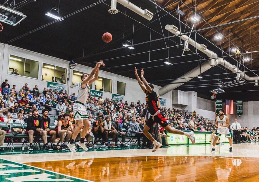 Action shot of Diego Bernard vs Pittsburg State basketball