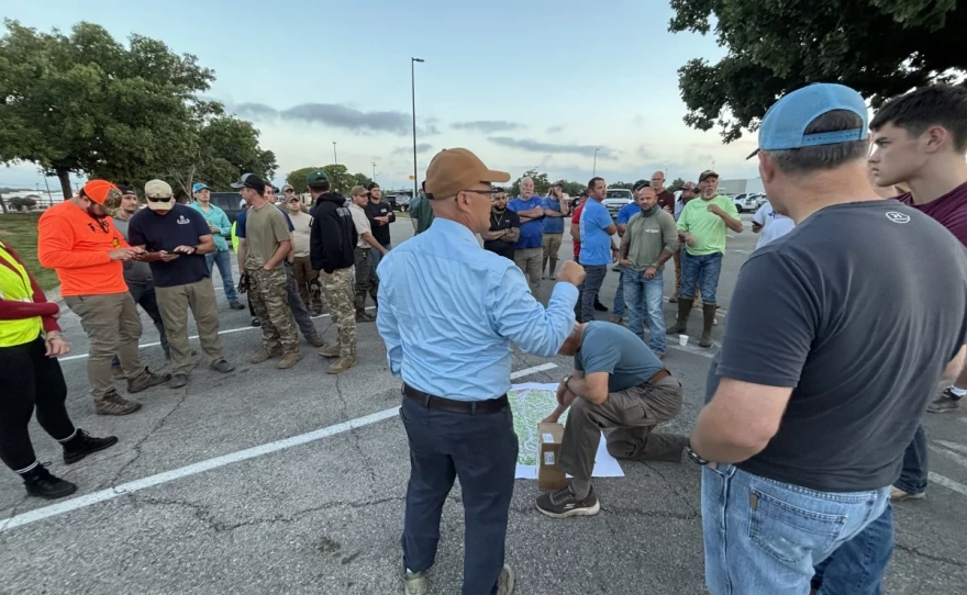 Thad Heartfield's son, Aidan, was lost in the flood in Kerr County with three other friends. Since then, he's led a search effort (center, blue shirt) to recover flood victims.