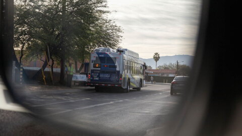 Sun Tran Bus reflection in vehicle side mirror