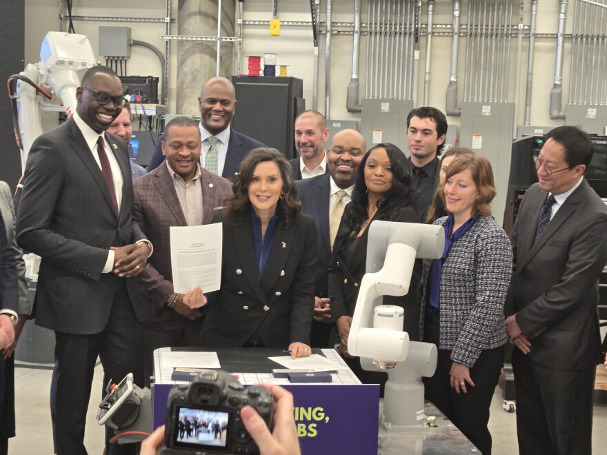 Michigan Governor Gretchen signs innovation bills in Detroit.