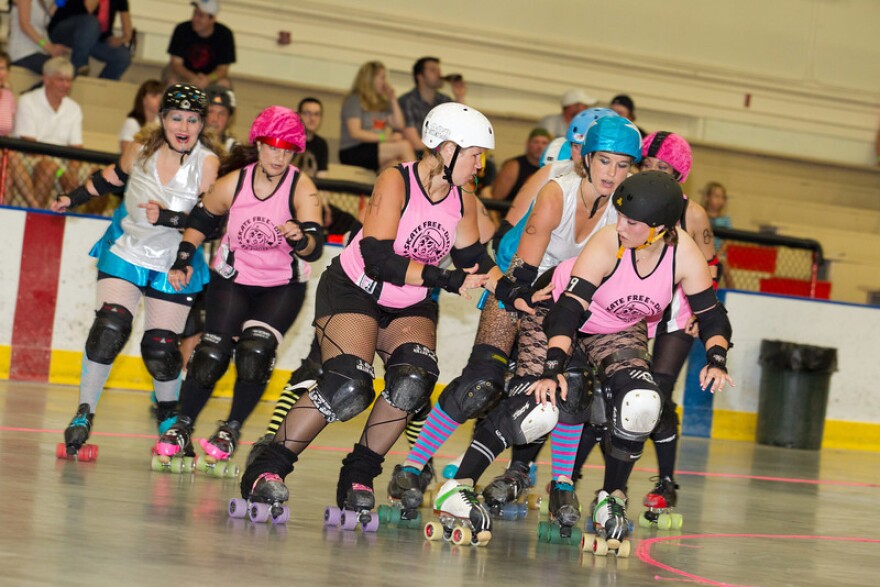 Granite State Roller Derby (in blue and silver) and New Hampshire Roller Derby on the flat track.