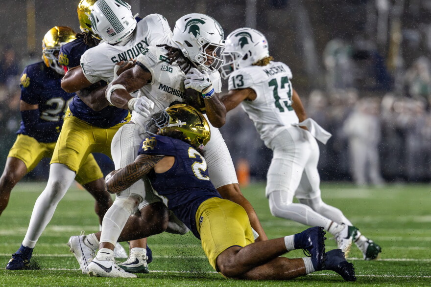 Notre Dame linebacker Kyngstonn Viliamu-Asa tackles Michigan State running back Cam Edwards