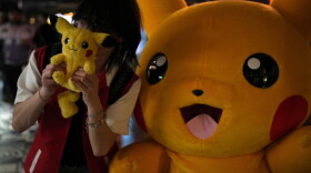 A fan poses for a photograph during Pokemon Day, as they celebrate the 30th anniversary of Pokemon, in London, Friday, Feb. 27, 2026.