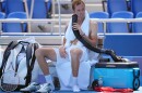 Daniil Medvedev cools down during the break with air from a mobile air conditioner and a towel with ice cubes at the Tokyo Olympics.