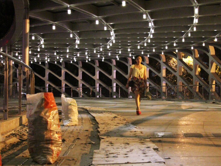 China's government has poured a fortune into infrastructure in part to boost GDP. Not all the money is well-spent. This pedestrian bridge in the Southern boomtown of Shenzhen cost more than $8 million. Less than two years old, it already requires repairs.