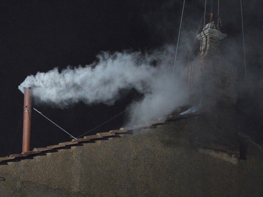 White smoke rises from the chimney on the roof of the Sistine Chapel meaning that cardinals elected a new pope on Wednesday, the second day of their secret conclave on at the Vatican.