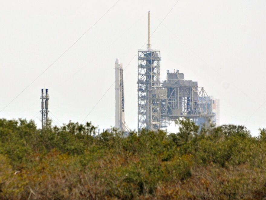 SpaceX's Falcon 9 rocket sits on the launch pad Saturday at Kennedy Space Center in Florida. SpaceX scrubbed the Saturday launch due to a technical issue. The company is tried again — and succeeded — on Sunday.