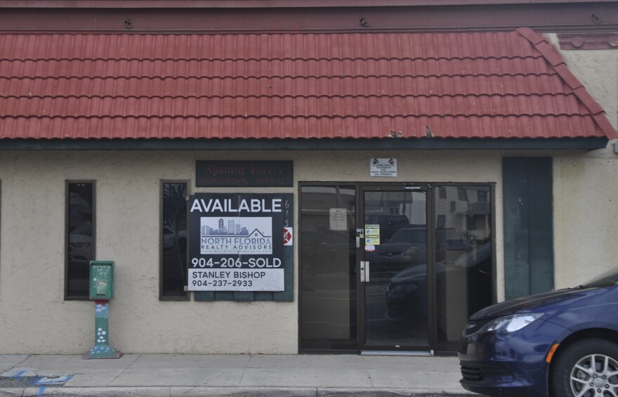 One of the buildings with a realty sign in the window, just a short walk from Sam Deputy’s store.