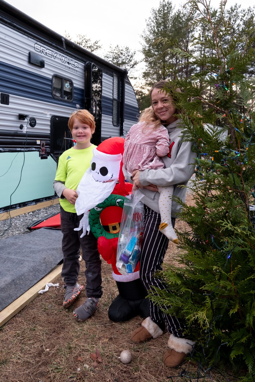 Sluder and her two children outside of their RV.