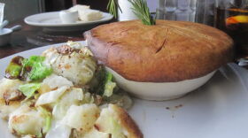 A pot pie with bubble and squeak on the side at Feast in New Orleans.