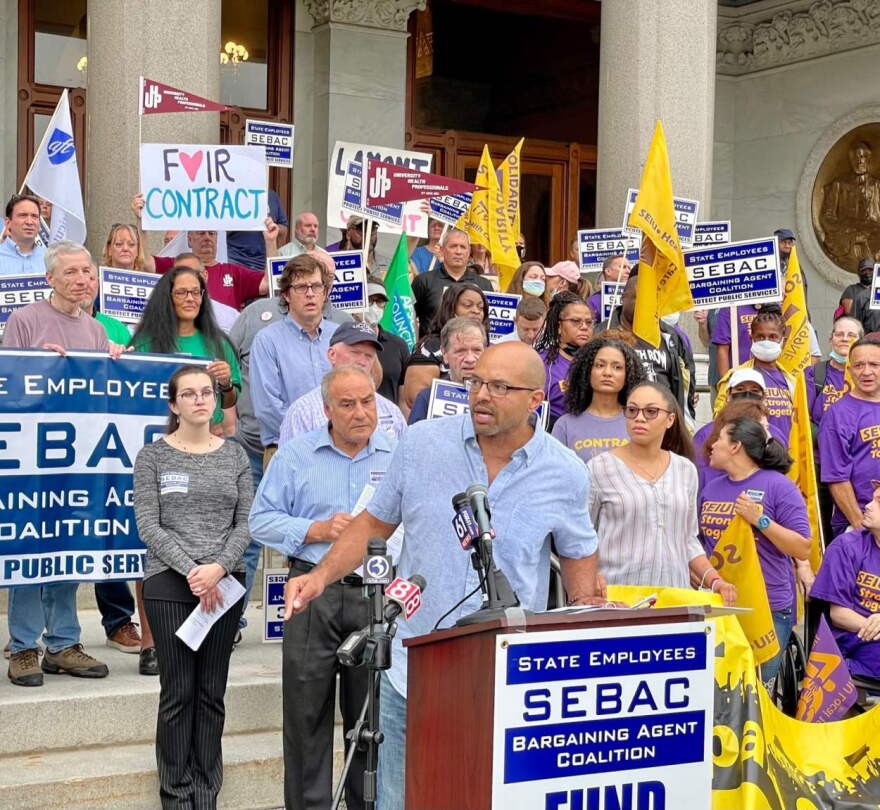 Rob Baril, the president of SEIU 1199, says state employees deserve raises. Behind him to the left is Sal Luciano, president of the state AFL-CIO.