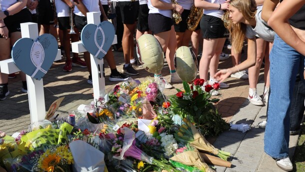 flowers, crosses and notes are part of a makeshift memorial at FSU