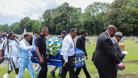 Pallbearers carry Lloyd Gilmore to his grave in Sikeston, Missouri. Gilmore died in police custody after an altercation with Sikeston police officers on June 10.