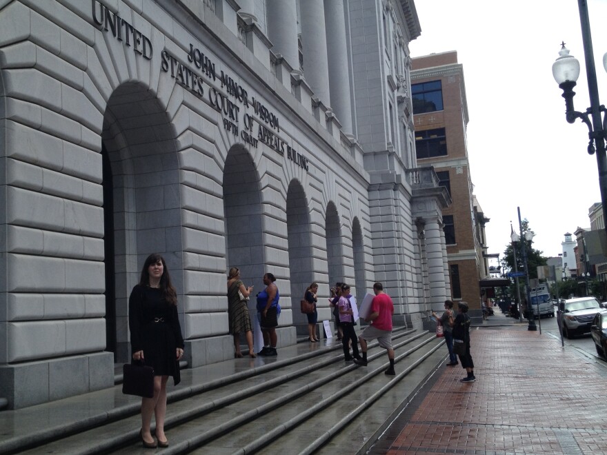 Supporters and opponents of Texas's controversial abortion law gathered Friday afternoon outside the 5th Circuit Court of Appeals in downtown New Orleans. Emily Horne (left) is a legislative associate with Texas Right to Life, a group that lobbied for the law.