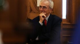 Sen. Lee Schoenbeck, R-Watertown, listens on the House floor ahead of the budget address at the South Dakota Capitol on Dec. 5, 2023.