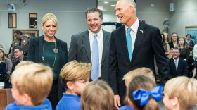 CFO Jimmy Patronis (center) is cracking down on cell phone spoofing.