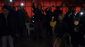 A crowd gathers outside of City Hall on Wednesday, November 1, 2017, to protest the sweeps of homeless camps in Seattle. 